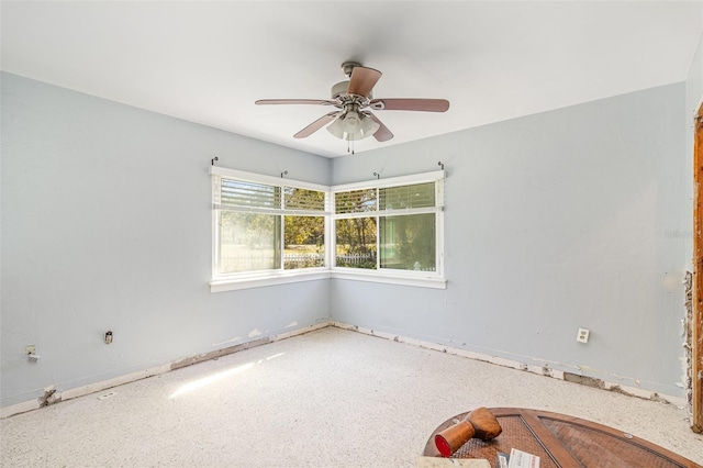 unfurnished room with ceiling fan