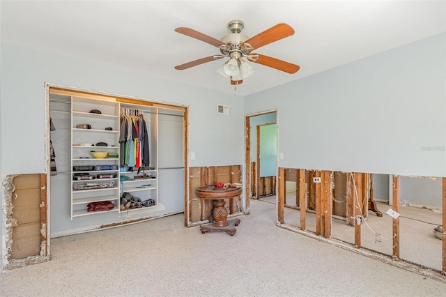 bedroom with a ceiling fan and a closet