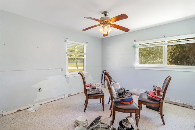 interior space with ceiling fan