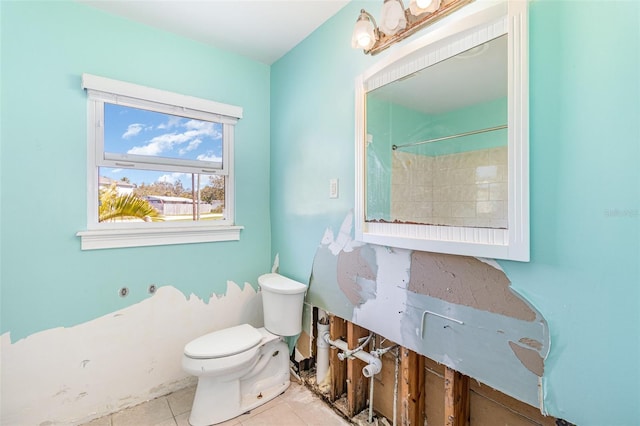 bathroom with tile patterned floors and toilet