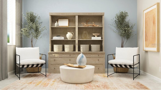 sitting room featuring tile patterned floors and baseboards