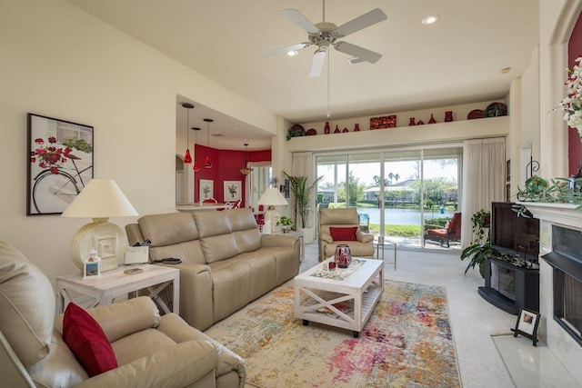 living area with recessed lighting, a ceiling fan, and carpet floors