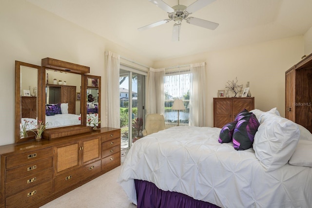 bedroom featuring carpet, a ceiling fan, and access to outside