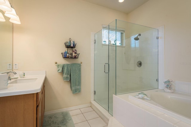 full bath featuring baseboards, a garden tub, a stall shower, tile patterned floors, and vanity