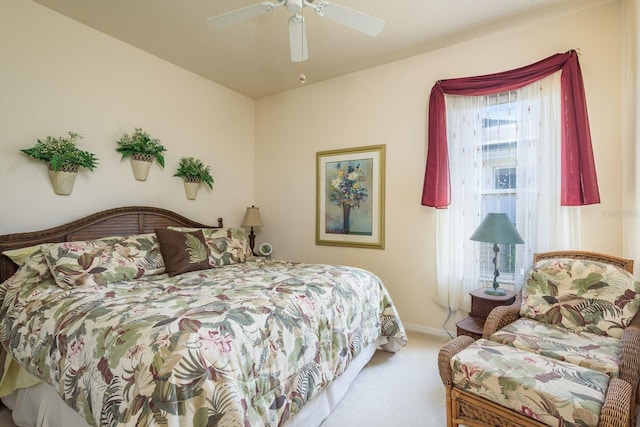 bedroom featuring ceiling fan, baseboards, and carpet floors