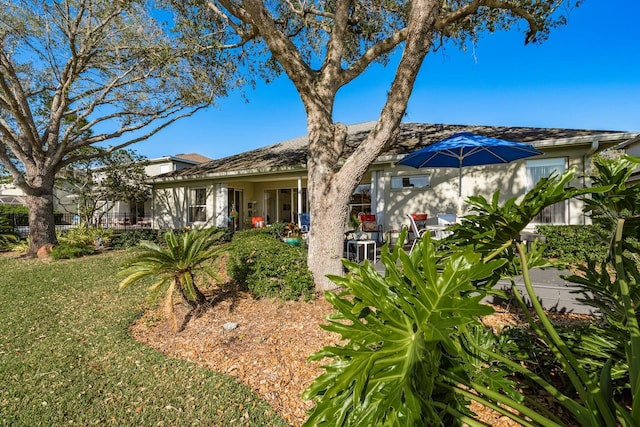 exterior space with a front lawn and fence