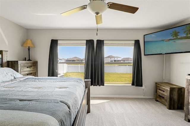 bedroom with baseboards, carpet, and ceiling fan