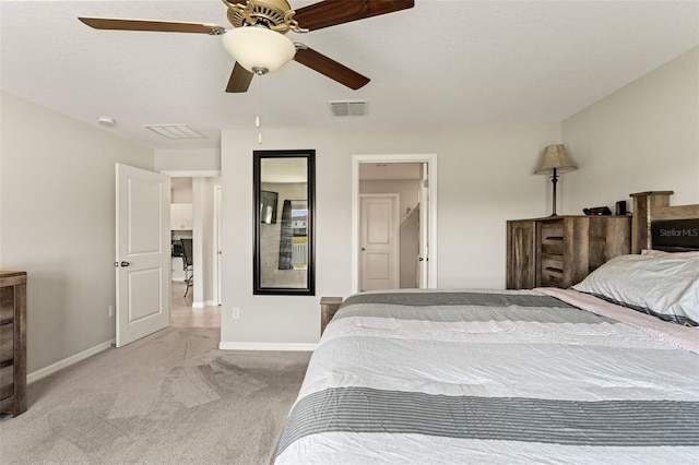 carpeted bedroom featuring visible vents, ceiling fan, and baseboards