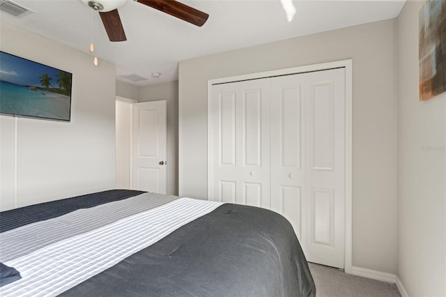 unfurnished bedroom with a ceiling fan, carpet, visible vents, baseboards, and a closet