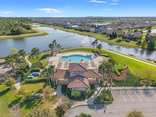 birds eye view of property featuring a residential view and a water view