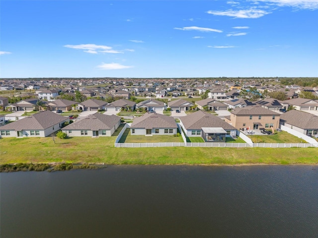 birds eye view of property featuring a residential view and a water view