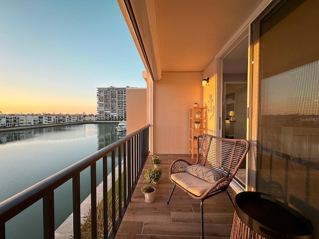 balcony featuring a water view