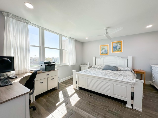 bedroom with recessed lighting, baseboards, and dark wood-type flooring