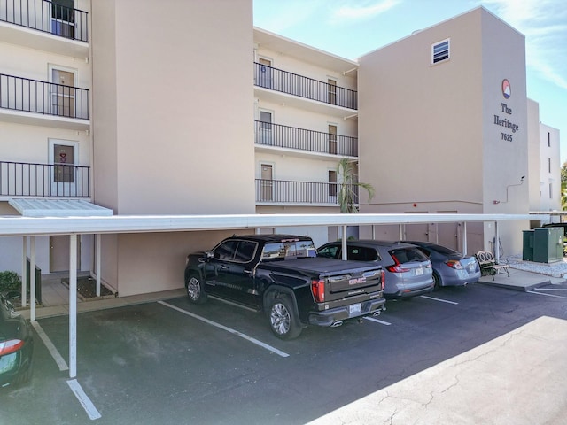 view of property featuring covered parking