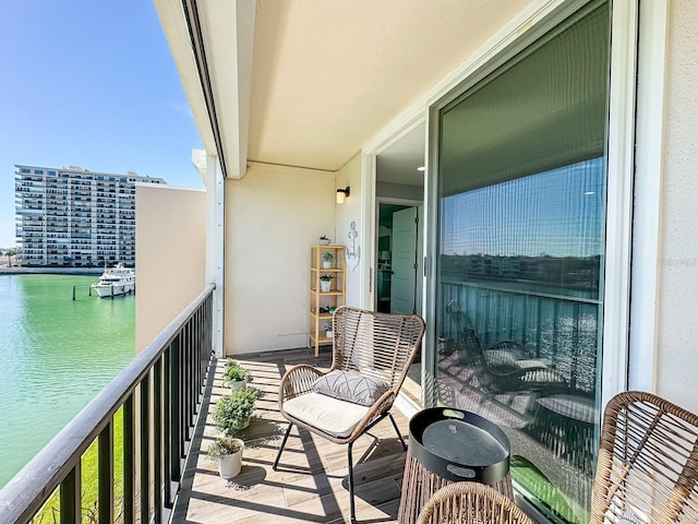 balcony featuring a water view