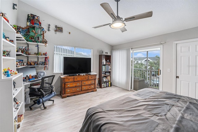 bedroom featuring vaulted ceiling, wood finished floors, a ceiling fan, and access to outside