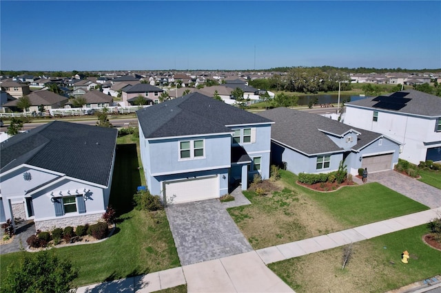 birds eye view of property with a residential view