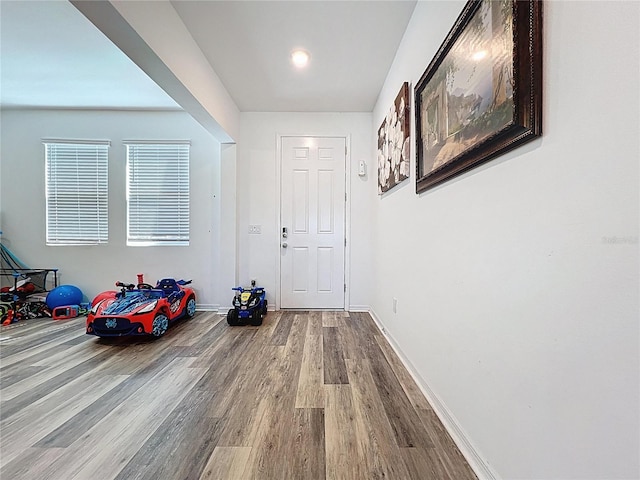 interior space featuring wood finished floors and baseboards