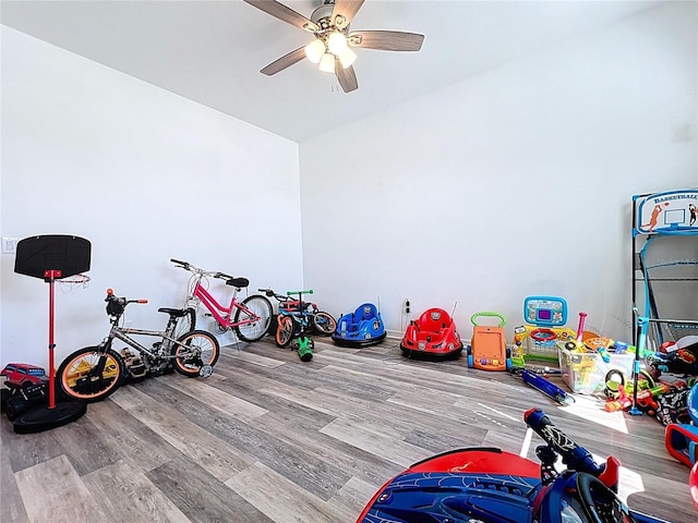 playroom with wood finished floors and ceiling fan