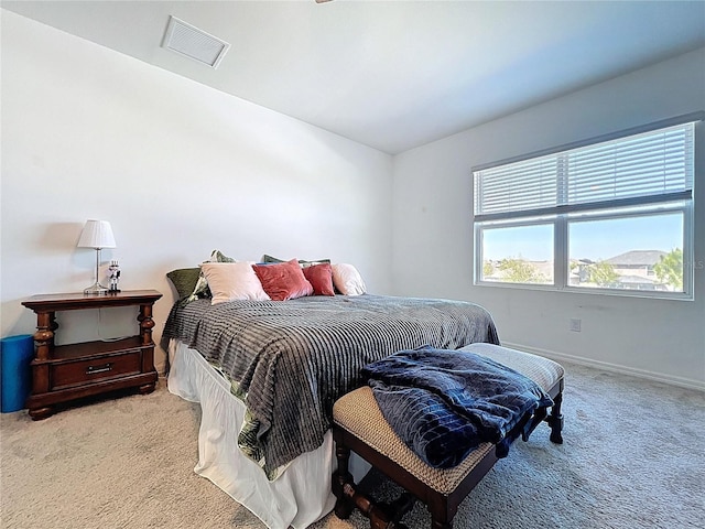 bedroom featuring baseboards, visible vents, and carpet floors