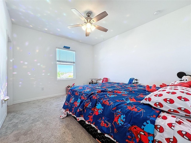 bedroom featuring ceiling fan, baseboards, and carpet