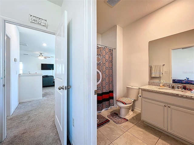 bathroom featuring vanity, ensuite bath, a ceiling fan, and visible vents