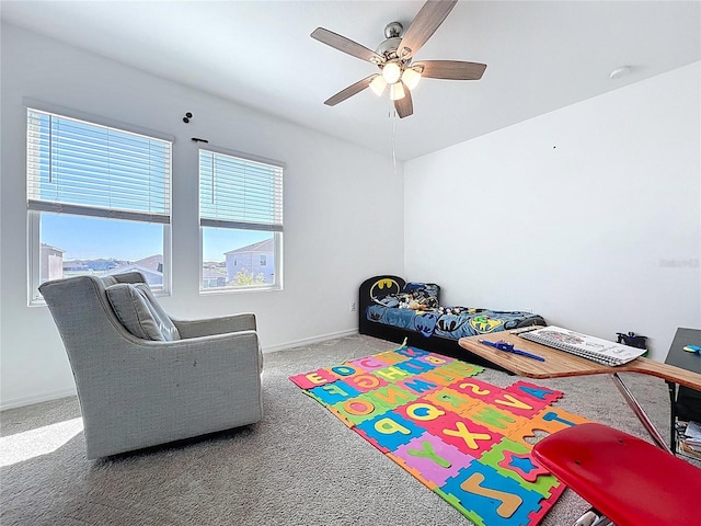 playroom with baseboards, carpet, and a ceiling fan