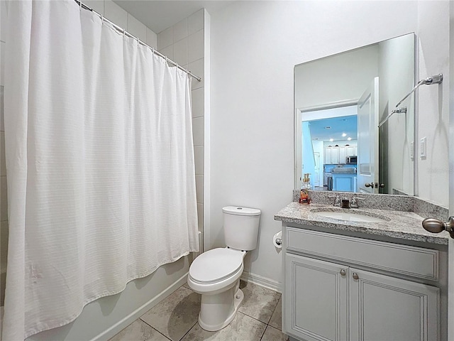 bathroom with vanity, baseboards, shower / tub combo, tile patterned floors, and toilet