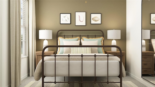 bedroom featuring baseboards and carpet