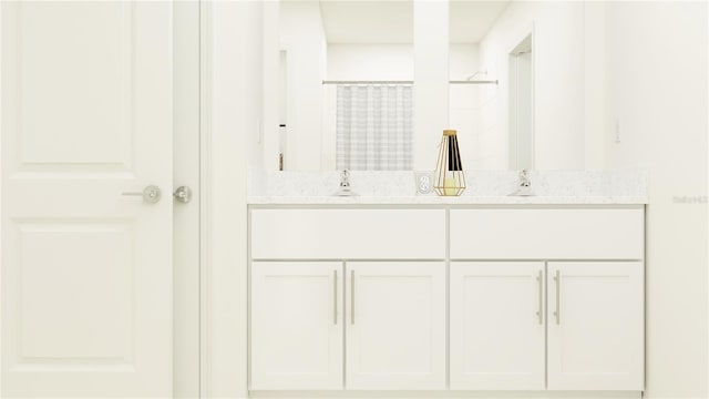 full bath featuring double vanity, a shower with shower curtain, and a sink