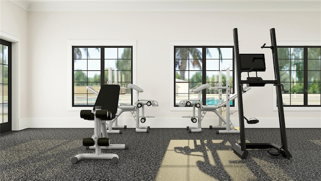 exercise area featuring baseboards