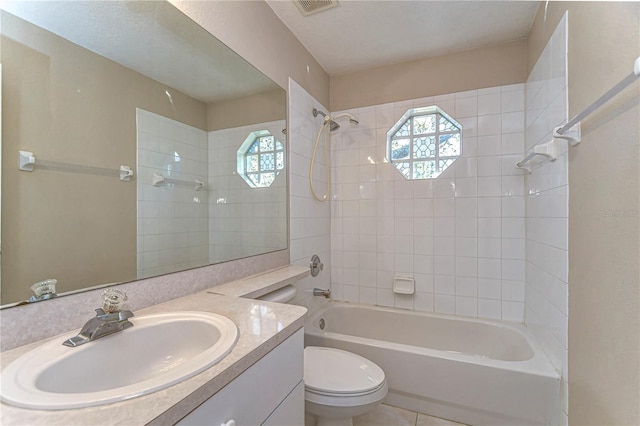 bathroom featuring visible vents, vanity, toilet, and shower / bathtub combination