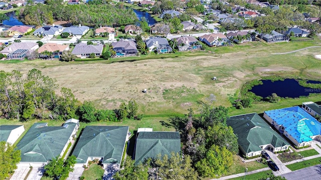 aerial view featuring a residential view and a water view