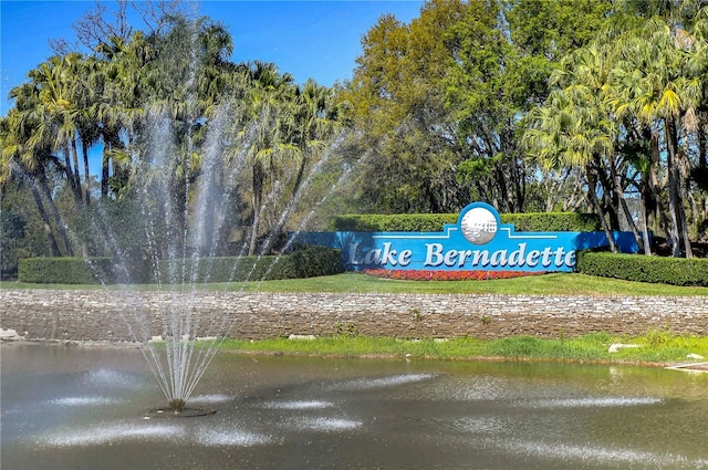 surrounding community featuring a water view