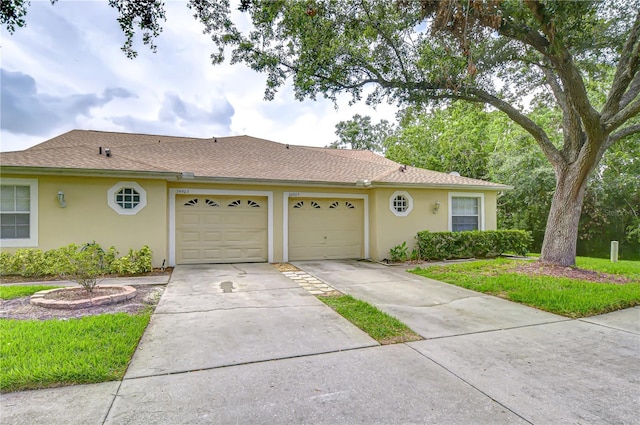 34907 Double Eagle Ct, Zephyrhills, FL 33541 - ranch-style house with stucco siding, a garage, concrete driveway, and roof with shingles