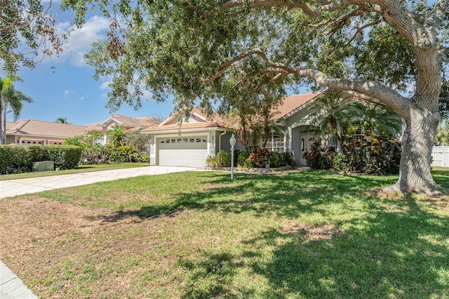 7581 Palmer Glen Cir, Sarasota, FL 34240 - view of front facade with a garage, concrete driveway, a front yard, a tiled roof, and stucco siding