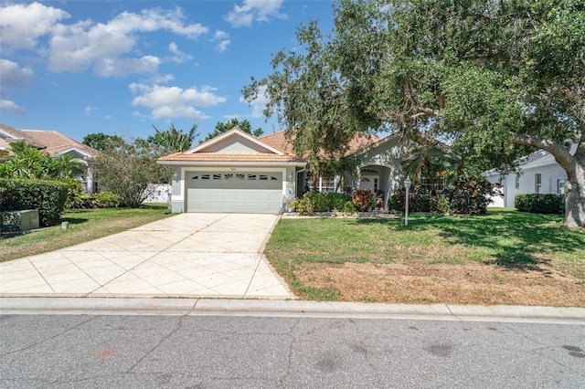 7581 Palmer Glen Cir, Sarasota, FL 34240 - view of front of property with an attached garage, a front lawn, and driveway