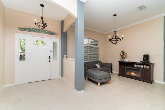 7581 Palmer Glen Cir, Sarasota, FL 34240 - foyer featuring a chandelier, arched walkways, baseboards, and crown molding