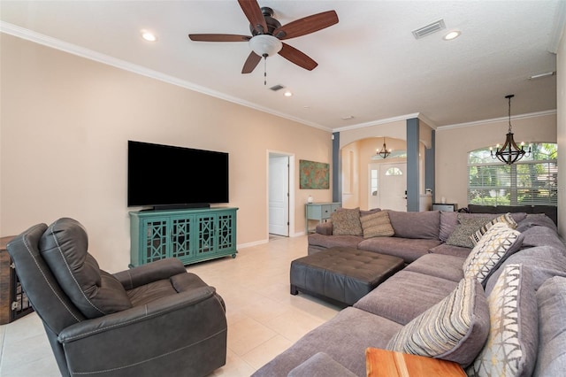 7581 Palmer Glen Cir, Sarasota, FL 34240 - living room with a chandelier, light tile patterned floors, arched walkways, a ceiling fan, and ornamental molding