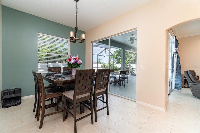 7581 Palmer Glen Cir, Sarasota, FL 34240 - dining area featuring plenty of natural light, arched walkways, and light tile patterned flooring