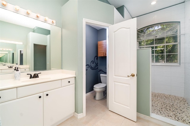 7581 Palmer Glen Cir, Sarasota, FL 34240 - bathroom with walk in shower, vanity, toilet, tile patterned flooring, and baseboards
