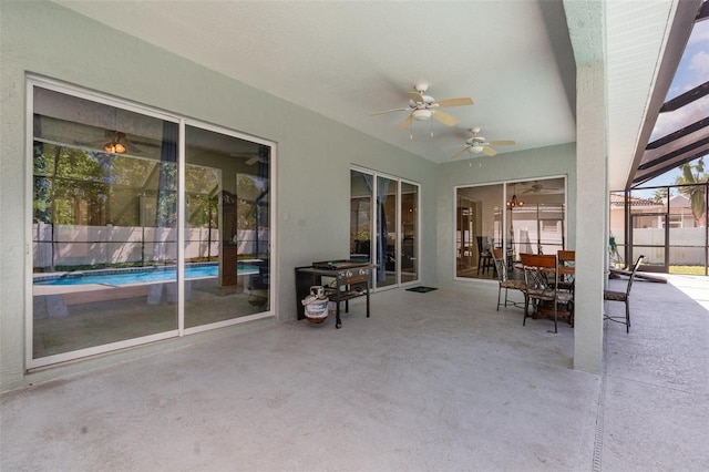 7581 Palmer Glen Cir, Sarasota, FL 34240 - view of patio featuring a ceiling fan, glass enclosure, and outdoor dining space