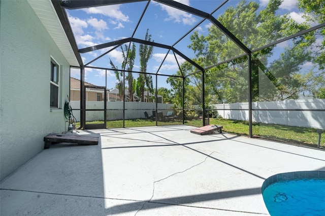 7581 Palmer Glen Cir, Sarasota, FL 34240 - fenced backyard featuring a patio area and glass enclosure