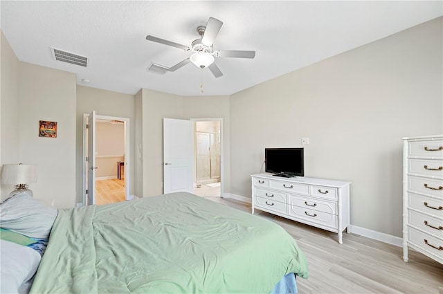 bedroom with visible vents, light wood-style flooring, a ceiling fan, and baseboards