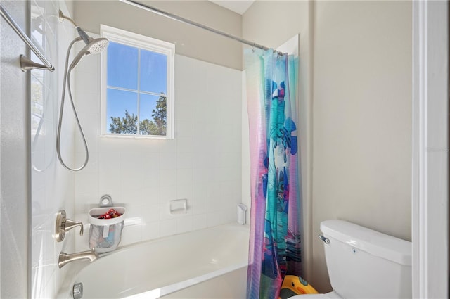 full bathroom featuring shower / tub combo with curtain and toilet