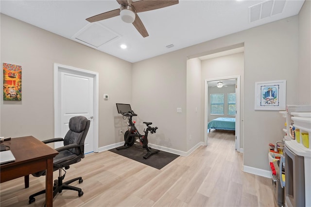 office featuring light wood-style flooring, baseboards, visible vents, and ceiling fan