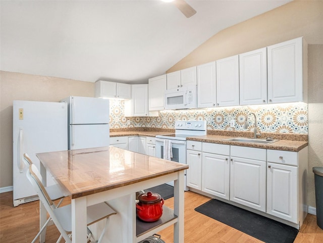 kitchen featuring white cabinets, white appliances, light wood-style flooring, and a sink