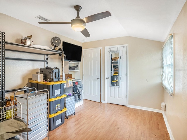 interior space with visible vents and ceiling fan