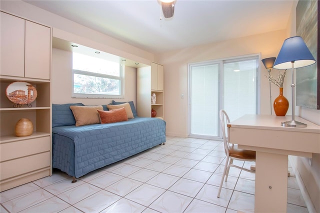 bedroom featuring light tile patterned floors and ceiling fan