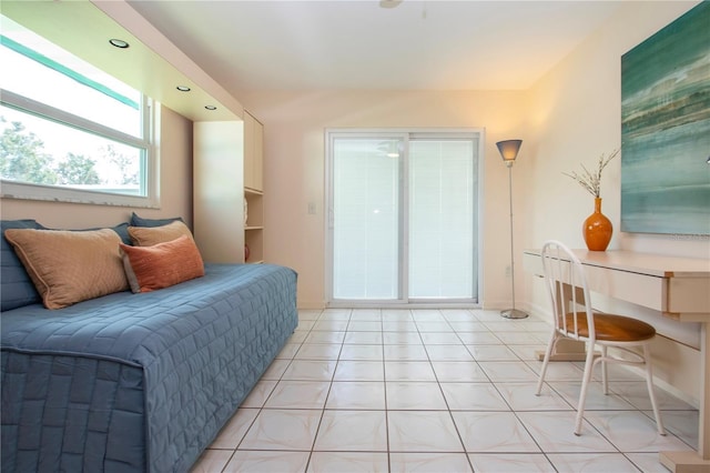 bedroom with light tile patterned floors